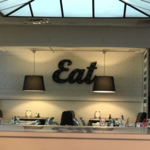 Off Street Cafe wall featuring word Eat